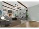 Bright living room featuring a fireplace, ceiling fan and wood beam ceiling at 717 Southeast 46Th Ct, Ocala, FL 34471