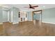 Spacious living room with hardwood floors and an open floor plan with seamless flow at 717 Southeast 46Th Ct, Ocala, FL 34471