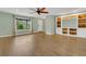 Bright living room boasts beautiful hardwood floors, built-in shelves, and abundant natural light at 717 Southeast 46Th Ct, Ocala, FL 34471