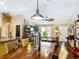 Open-concept home with dining area flowing into living room, featuring stylish furnishings at 750 Eden Pl, The Villages, FL 32162