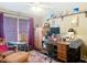Comfortable home office with natural light, a large desk, and ample storage space at 750 Eden Pl, The Villages, FL 32162