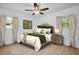Bedroom with wood floors, neutral paint, and bright natural light at 841 S Michigan Ave, Groveland, FL 34736