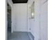 Bright entryway featuring white painted walls, a window, and a doorway to the interior at 841 S Michigan Ave, Groveland, FL 34736