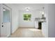Bright kitchen area with updated cabinets and modern fixtures, complemented by natural light at 841 S Michigan Ave, Groveland, FL 34736