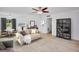 Bright living room features modern furniture, light wood floors, and neutral tones at 841 S Michigan Ave, Groveland, FL 34736