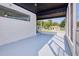 Spacious screened-in porch with painted floor, offering an inviting outdoor living space at 841 S Michigan Ave, Groveland, FL 34736