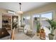 Sunroom featuring a tile floor, multiple windows, and natural light at 851 Evelynton Loop, The Villages, FL 32162