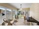 Bright sunroom with tile floor, lots of windows, and a view of the backyard at 851 Evelynton Loop, The Villages, FL 32162