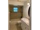 Bathroom featuring tub, modern sink, and window to allow for plenty of light at 901 Baylor Dr, Deltona, FL 32725