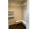 Walk in closet with custom shelving and hardwood floors at 901 Baylor Dr, Deltona, FL 32725