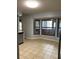 A large kitchen with tile flooring, great natural light and stainless steel appliances at 901 Baylor Dr, Deltona, FL 32725