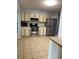 A well-equipped kitchen featuring stainless steel appliances and lots of cabinet space at 901 Baylor Dr, Deltona, FL 32725