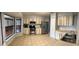 Kitchen with stainless steel appliances, tile flooring, two-toned cabinets, and lots of natural light at 901 Baylor Dr, Deltona, FL 32725