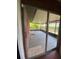 Enclosed porch with room for seating, leading to back yard at 901 Baylor Dr, Deltona, FL 32725