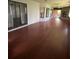 Spacious sunroom with sliding doors, hardwood floors and a fireplace at 901 Baylor Dr, Deltona, FL 32725