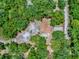 Overhead view of home surrounded by lush greenery, emphasizing a generous lot size and tranquil setting at 9144 Sw 156Th Pl, Dunnellon, FL 34432