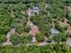 Bird's eye view demonstrates the property's tree cover within established borders, promoting a serene environment at 9144 Sw 156Th Pl, Dunnellon, FL 34432