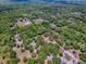 Expansive aerial view of wooded property with cozy home and verdant, mature trees at 9144 Sw 156Th Pl, Dunnellon, FL 34432