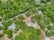 High-angle view shows a tree-lined property with defined boundaries, offering seclusion and ample space at 9144 Sw 156Th Pl, Dunnellon, FL 34432