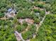 Aerial capture displays a residential lot encircled by trees and marked boundaries, creating an oasis-like feel at 9144 Sw 156Th Pl, Dunnellon, FL 34432