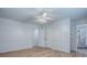Bedroom with new flooring, access to shower, closet, and hallway at 9144 Sw 156Th Pl, Dunnellon, FL 34432
