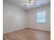 A bright bedroom featuring wood flooring and a ceiling fan at 9144 Sw 156Th Pl, Dunnellon, FL 34432