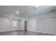 Spacious bedroom featuring multiple closets, grey wood-look flooring, and white walls at 9144 Sw 156Th Pl, Dunnellon, FL 34432