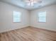 Bedroom with two windows allowing natural light to brighten up the room at 9144 Sw 156Th Pl, Dunnellon, FL 34432