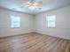 Bedroom featuring new flooring and two bright windows at 9144 Sw 156Th Pl, Dunnellon, FL 34432