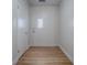 Bright entryway with fresh white paint, modern lighting, wood floor, and ample closet space at 9144 Sw 156Th Pl, Dunnellon, FL 34432