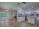 Open concept kitchen and living room with stainless steel appliances and view to backyard at 9144 Sw 156Th Pl, Dunnellon, FL 34432