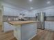 Well-appointed kitchen with white cabinets, butcher block countertops, and stainless steel appliances at 9144 Sw 156Th Pl, Dunnellon, FL 34432