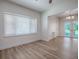 Bright living room with large window and access to a screened patio at 9144 Sw 156Th Pl, Dunnellon, FL 34432