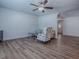 Open living area with light wood flooring and neutral decor with an arched room divider at 9144 Sw 156Th Pl, Dunnellon, FL 34432