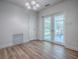 Sun room with a door to outside and tile flooring, bringing in natural light and outdoor views at 9144 Sw 156Th Pl, Dunnellon, FL 34432