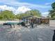 Backyard view showcasing the pool and screened patio that offers relaxation and recreation at 9364 Se 164Th Pl, Summerfield, FL 34491