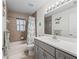 Bathroom with gray vanity, tub with shower, decorative curtain, and mermaid-themed accents at 9364 Se 164Th Pl, Summerfield, FL 34491