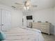 Bedroom featuring white walls, ceiling fan, comfy bed, and a dresser at 9364 Se 164Th Pl, Summerfield, FL 34491