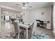 The dining area opens to the kitchen and features seating for four, neutral decor, and natural light at 9364 Se 164Th Pl, Summerfield, FL 34491