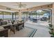 Screened in patio has ample seating and dining, perfect for entertaining and relaxation at 9364 Se 164Th Pl, Summerfield, FL 34491