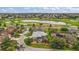 Discover the perfect home in a golf course community with a sparkling pool, as shown in this aerial view at 946 Isle Of Palms Path, The Villages, FL 32162