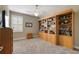 Bedroom featuring a ceiling fan and a custom wood bookcase at 946 Isle Of Palms Path, The Villages, FL 32162