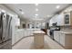 Bright, spacious kitchen features modern white cabinetry, granite countertops and stainless appliances at 946 Isle Of Palms Path, The Villages, FL 32162