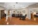 Spacious living room with hardwood floors, tray ceilings, recessed lights and elegant decor at 946 Isle Of Palms Path, The Villages, FL 32162