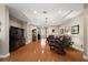 Spacious living room featuring hardwood floors, recessed lighting, and a decorative chandelier at 946 Isle Of Palms Path, The Villages, FL 32162