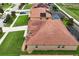 Overhead aerial view showcases red tile roof, landscaping, and neighboring properties at 10240 Kabana Blvd, Clermont, FL 34711