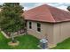 Charming backyard features a well-maintained lawn and a lovely screened-in porch for relaxation at 10240 Kabana Blvd, Clermont, FL 34711