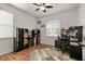 Cozy bedroom or office space with natural lighting, a ceiling fan, and lots of shelving for storage at 10240 Kabana Blvd, Clermont, FL 34711