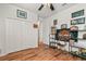 Bedroom with laminate wood flooring, closet, and displays showcasing motorcycles and racing memorabilia at 10240 Kabana Blvd, Clermont, FL 34711