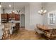 Charming dining area adjacent to kitchen with tile flooring and modern chandelier at 10240 Kabana Blvd, Clermont, FL 34711